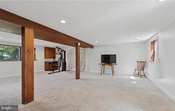 a view of livingroom with furniture and a flat screen tv