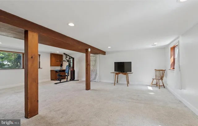 a view of livingroom with furniture and a flat screen tv