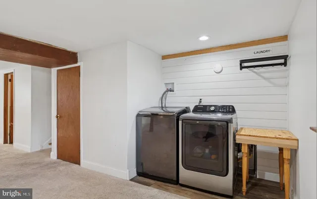 a utility room with washer and dryer