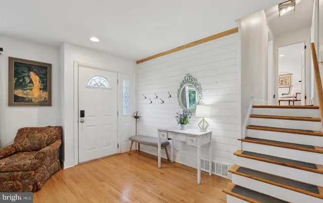 a living room with furniture and a painting