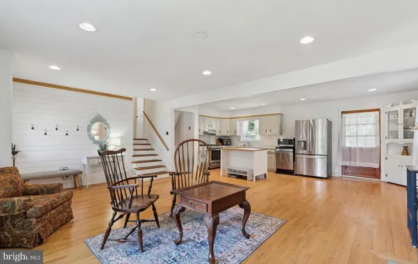 a livingroom with furniture and a wooden floor