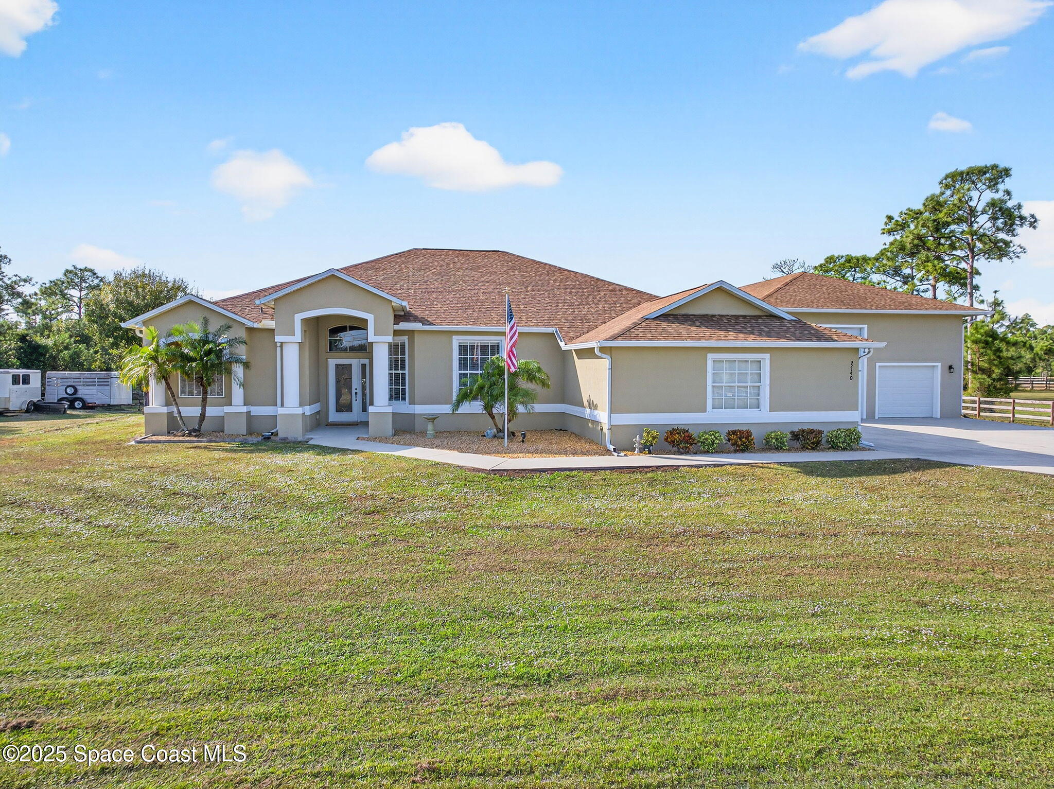 2740 Waring Lane Malabar, FL 32950 - Photo 2 of 98 a front view of a house with swimming pool