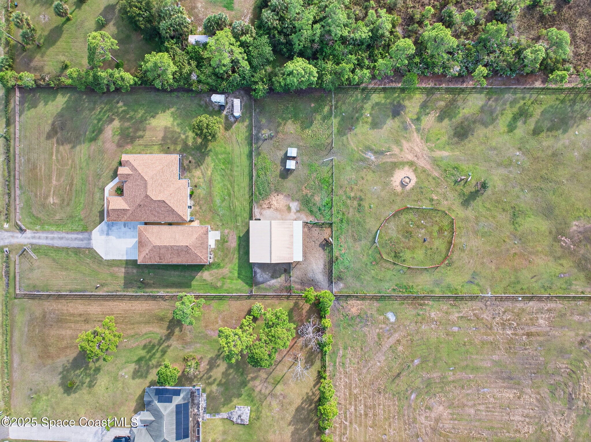 2740 Waring Lane Malabar, FL 32950 - Photo 35 of 98 an aerial view of a house with a lake view