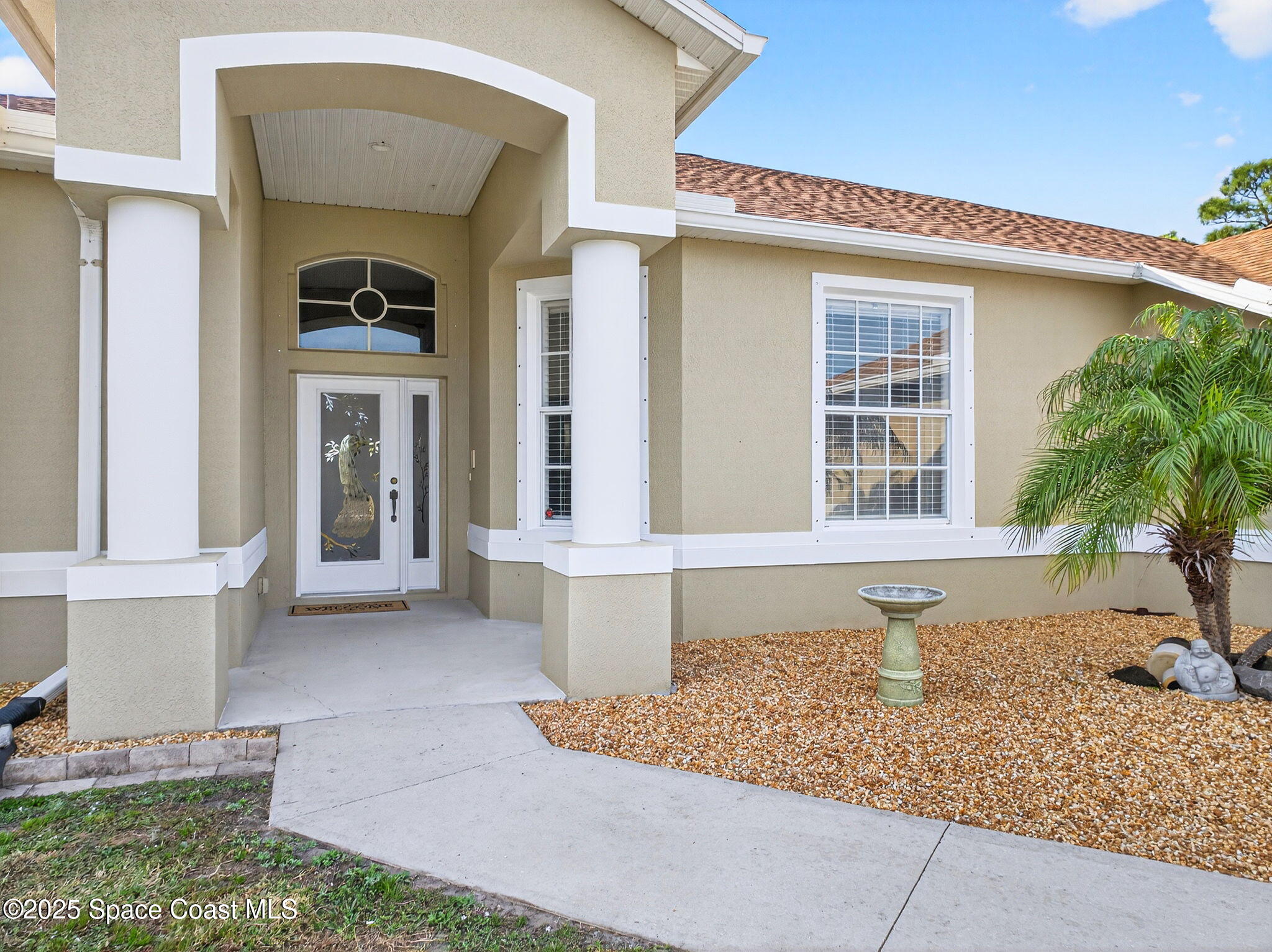 2740 Waring Lane Malabar, FL 32950 - Photo 39 of 98 a front view of a house with a yard
