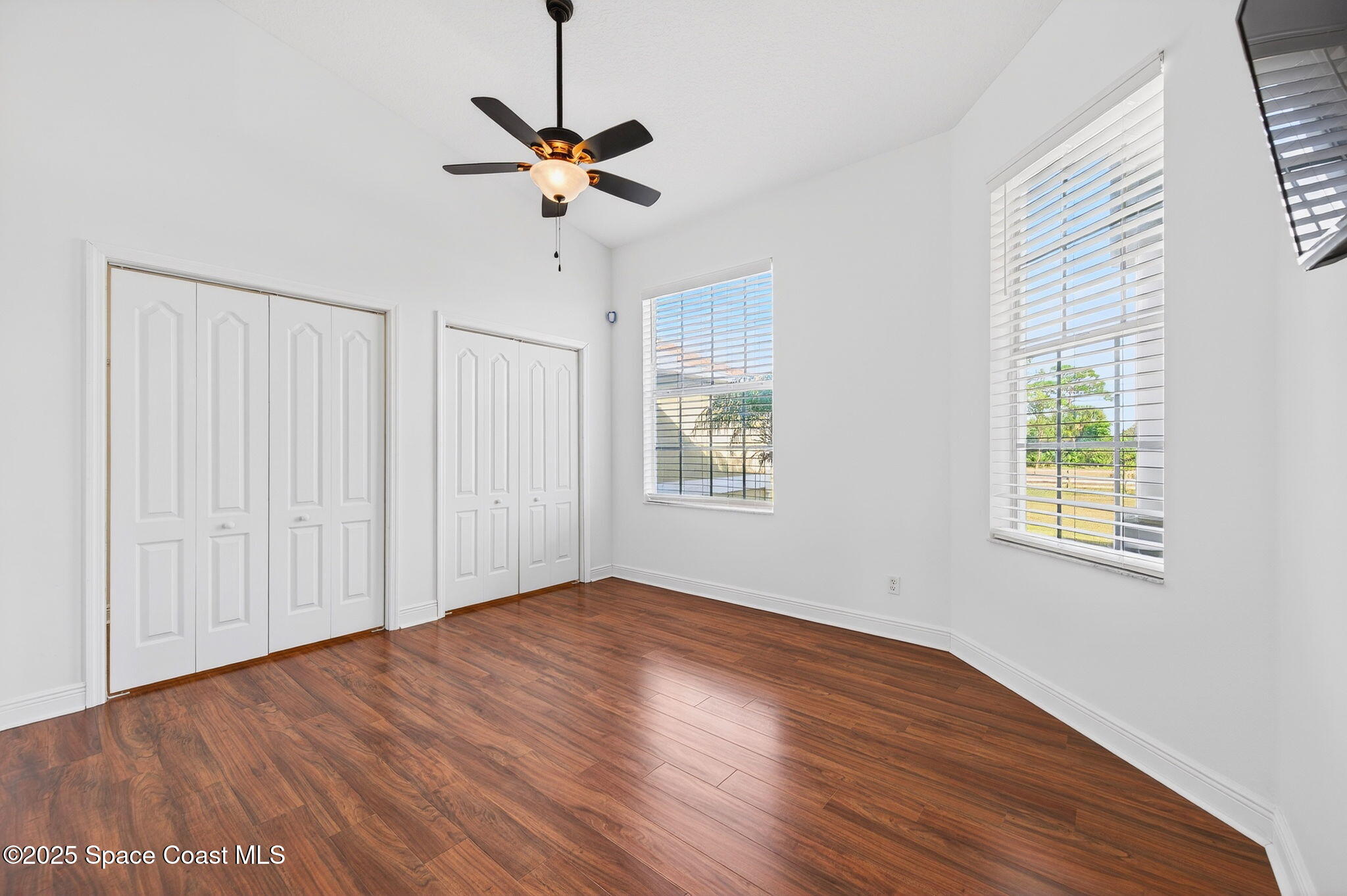 2740 Waring Lane Malabar, FL 32950 - Photo 48 of 98 a view of empty room with wooden floor and fan