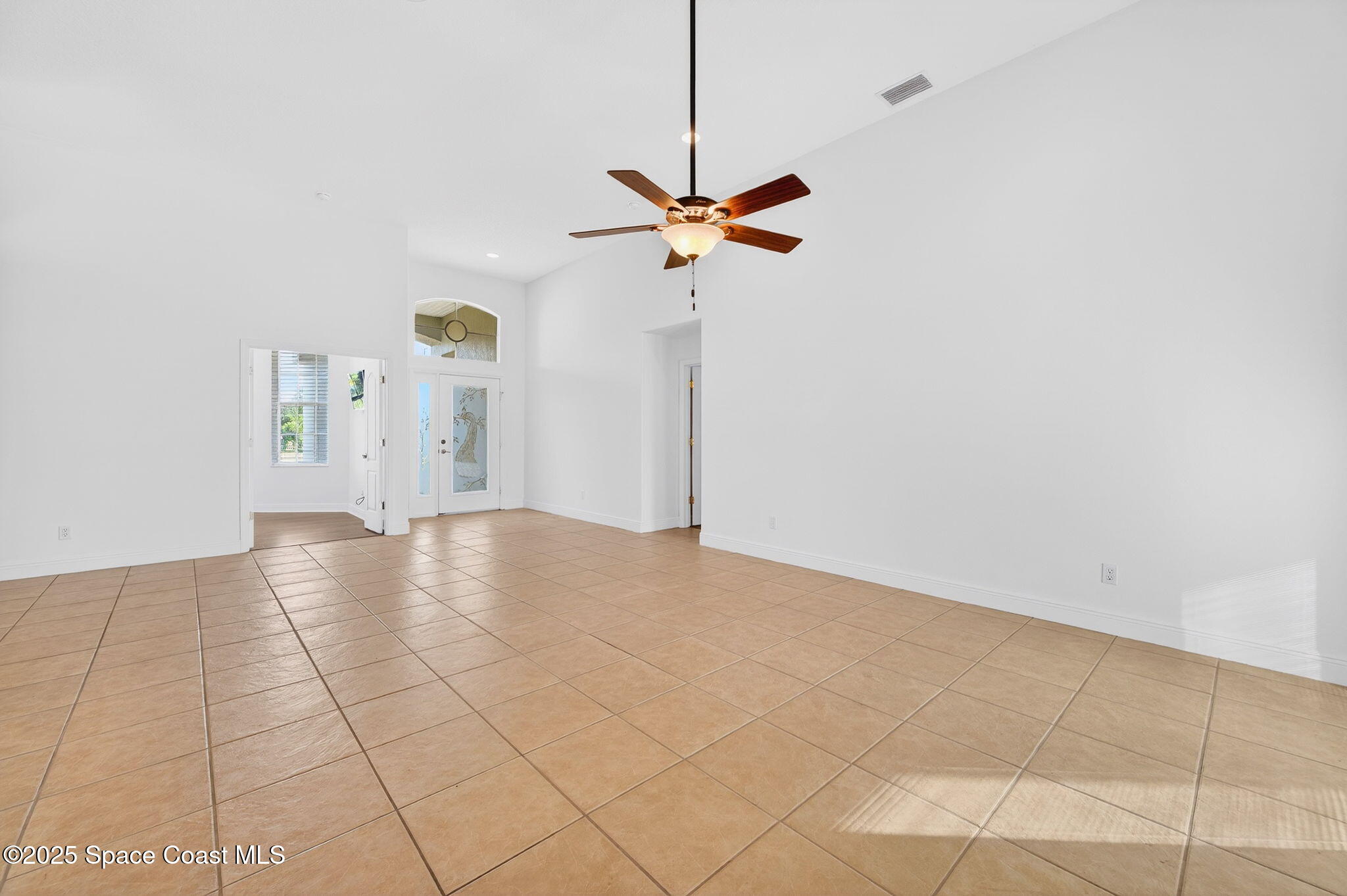2740 Waring Lane Malabar, FL 32950 - Photo 55 of 98 a view of a room with a ceiling fan and window