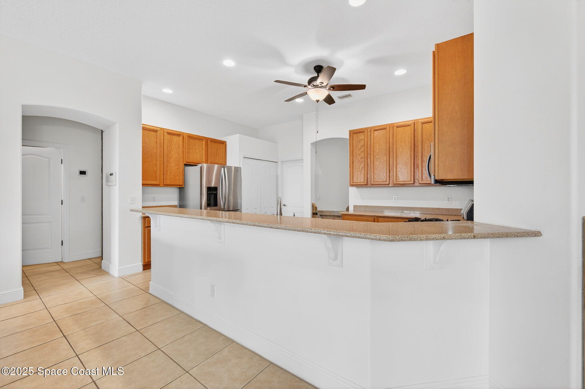 2740 Waring Lane Malabar, FL 32950 - Photo 58 of 98 a view of living room with granite countertop cabinets and fireplace