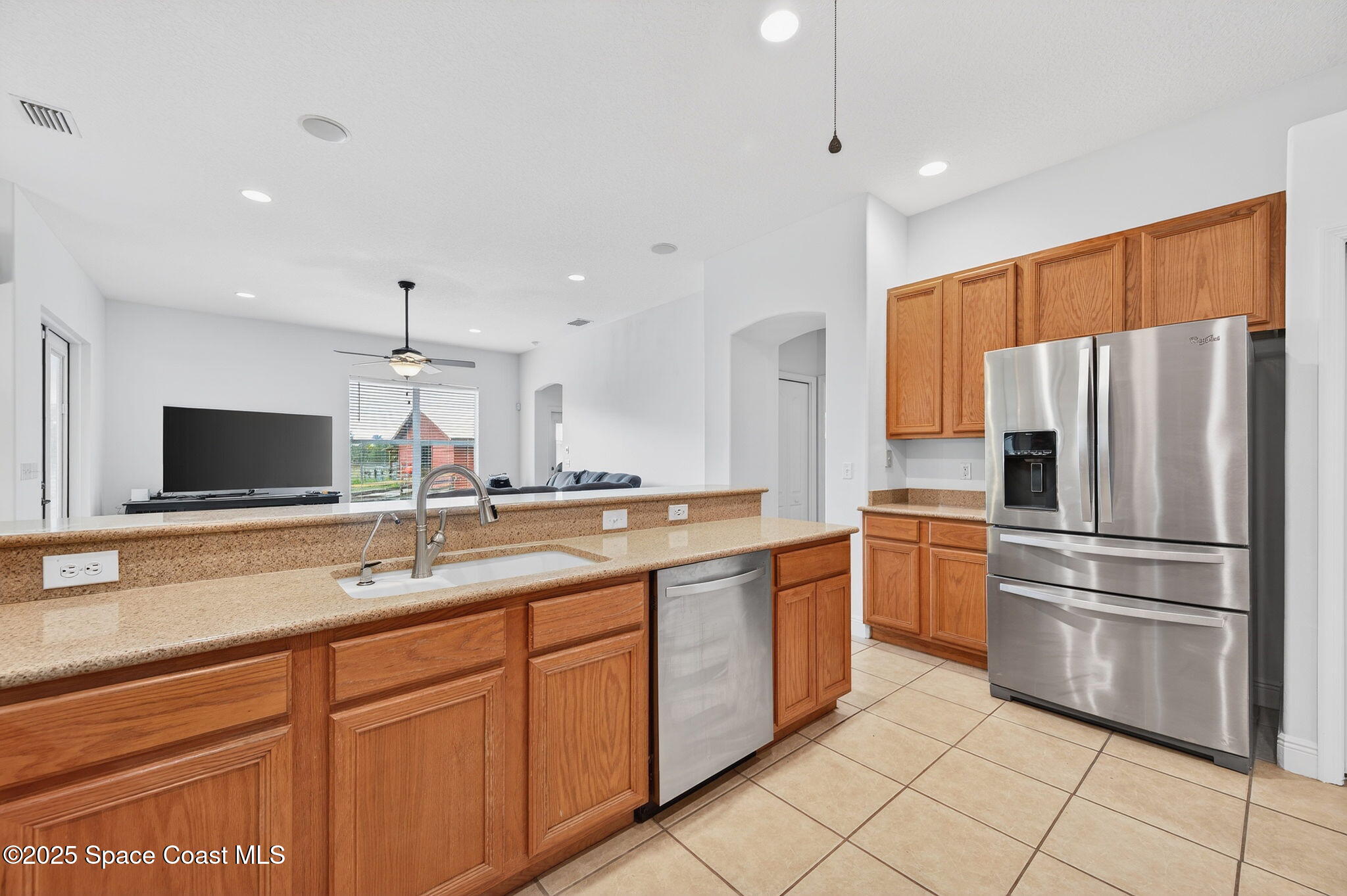 2740 Waring Lane Malabar, FL 32950 - Photo 63 of 98 a kitchen with cabinets and stainless steel appliances