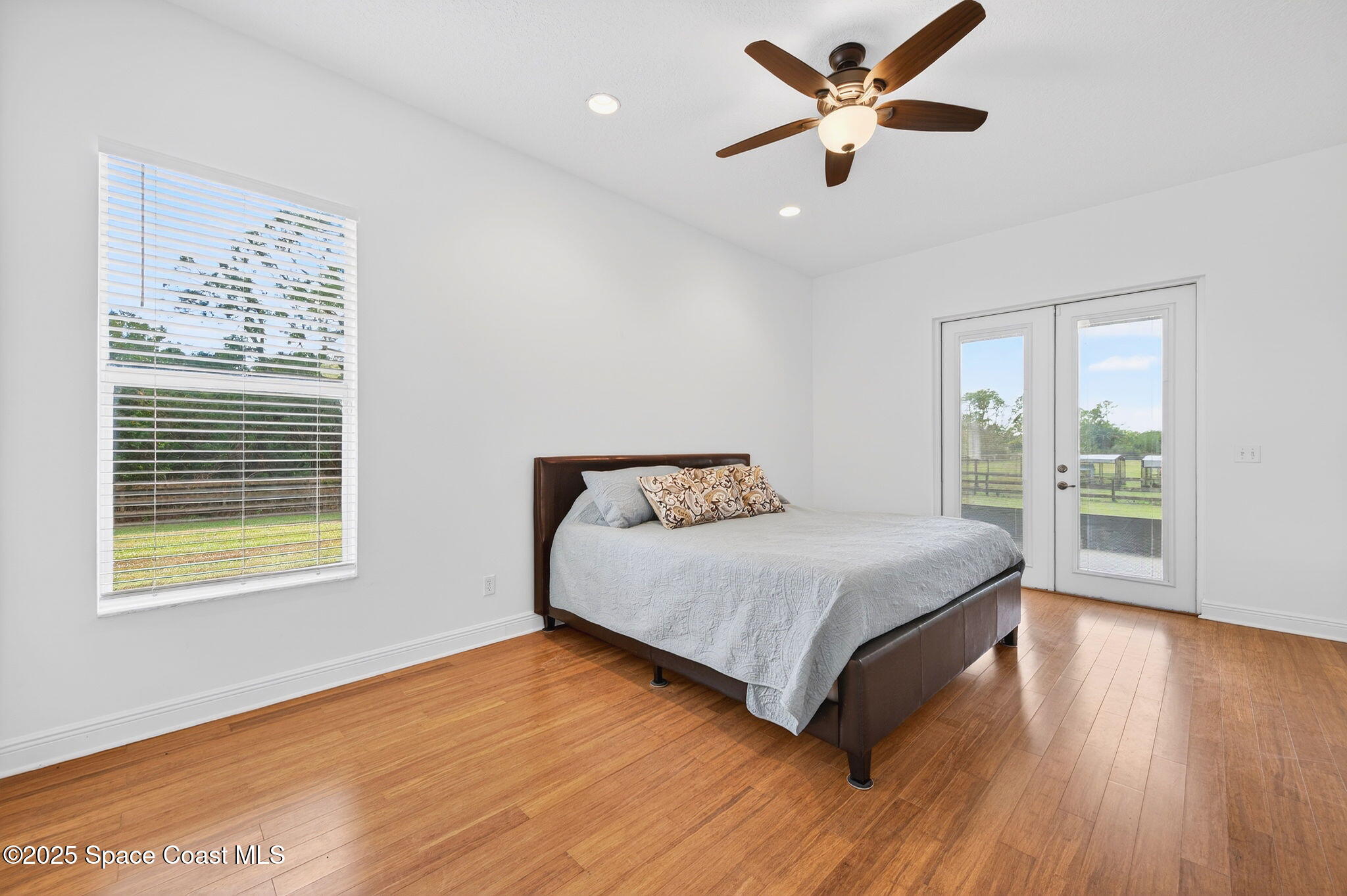 2740 Waring Lane Malabar, FL 32950 - Photo 65 of 98 a bedroom with a bed and a large window
