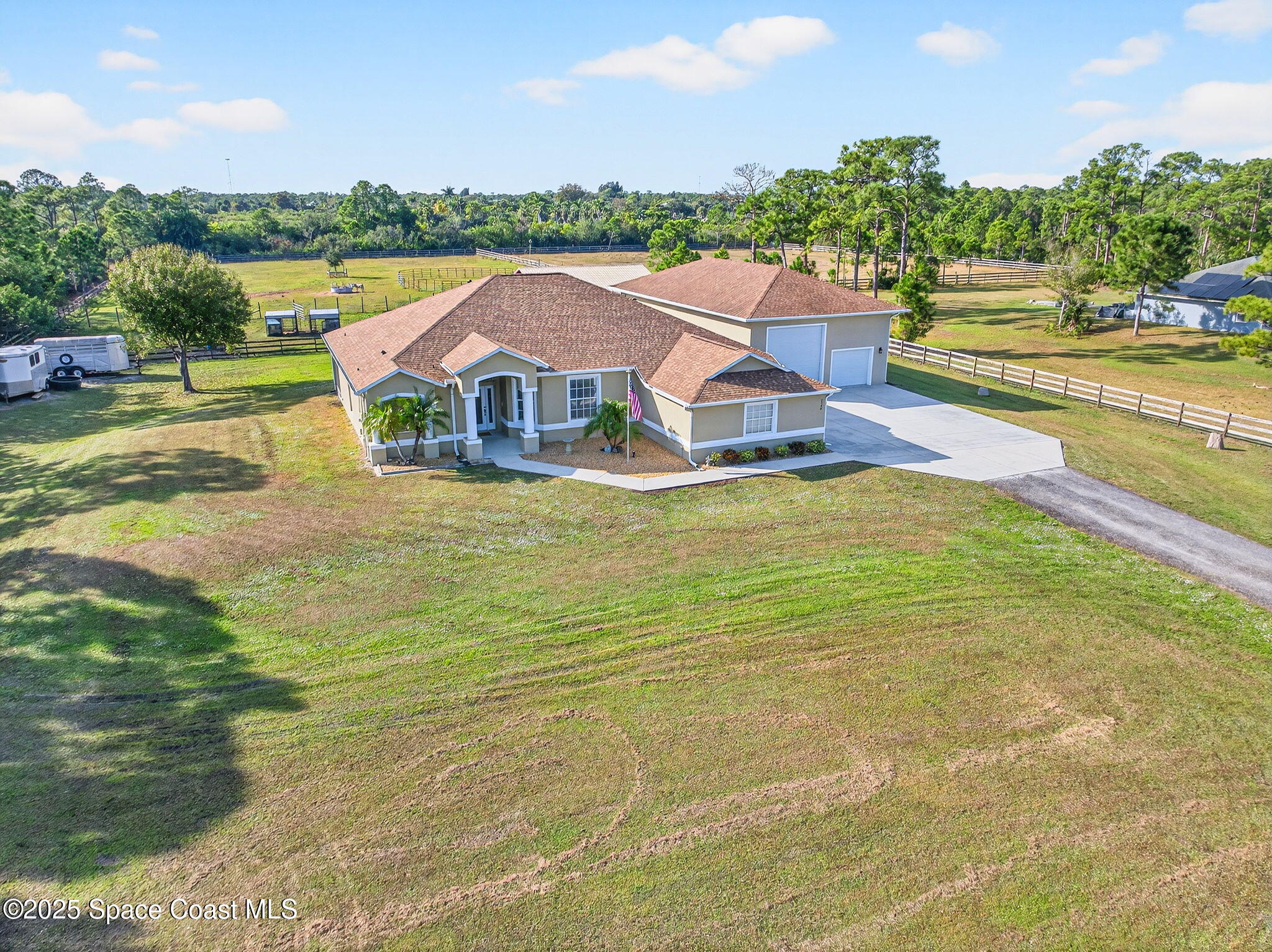 2740 Waring Lane Malabar, FL 32950 - Photo 7 of 98 a view of a city with lawn chairs and large trees