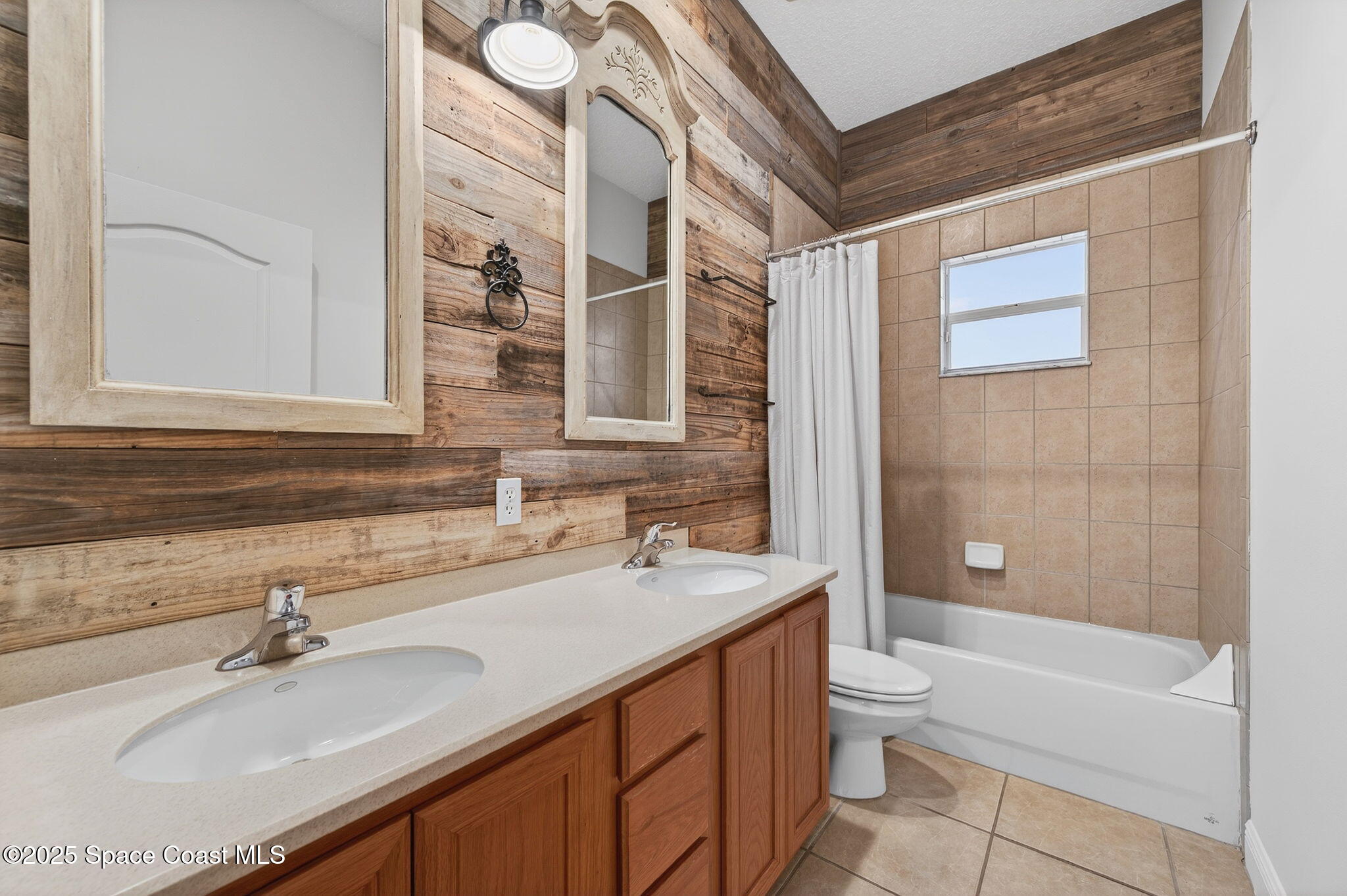 2740 Waring Lane Malabar, FL 32950 - Photo 74 of 98 a bathroom with a sink a toilet a tub and shower