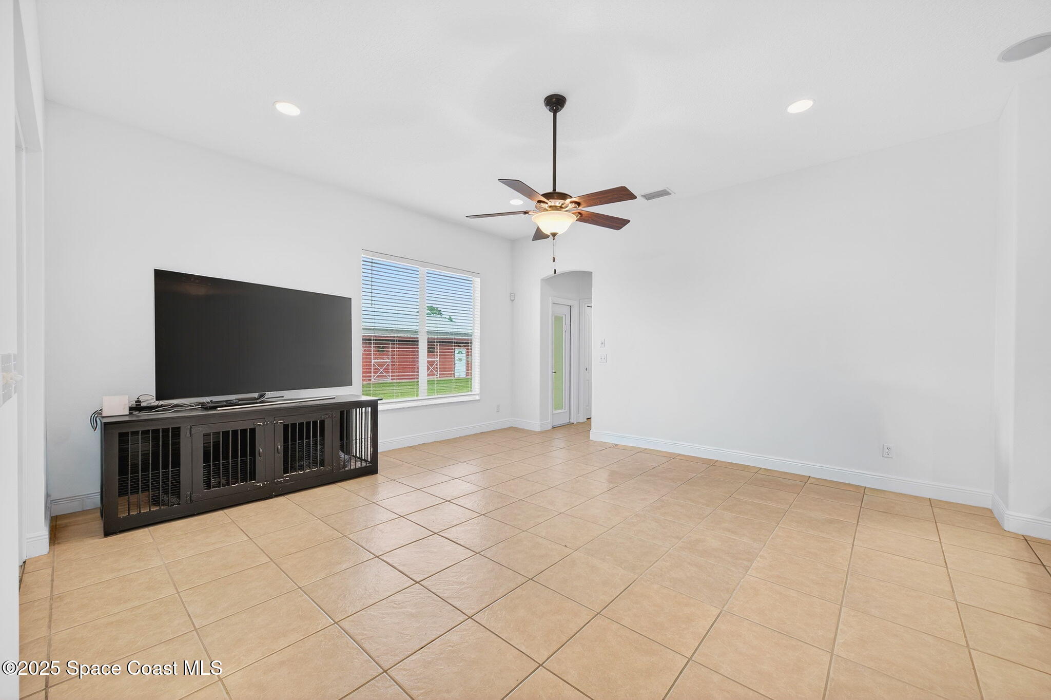 2740 Waring Lane Malabar, FL 32950 - Photo 78 of 98 a view of a livingroom with furniture and a flat screen tv
