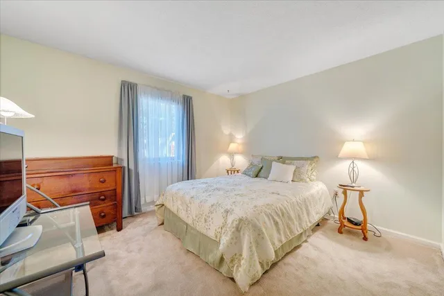 a bedroom with a bed and dresser