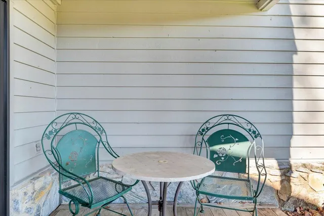 an aerial view of a house with a yard basket ball court and outdoor seating