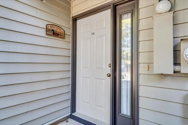 a view of front door and bedroom