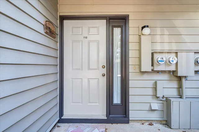 an aerial view of lake residential house with swimming pool and outdoor seating