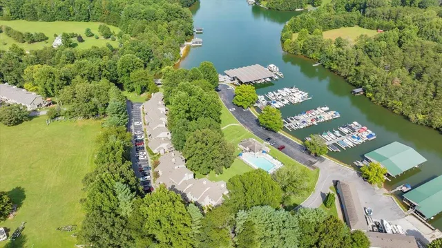 an aerial view of a residential houses with outdoor space