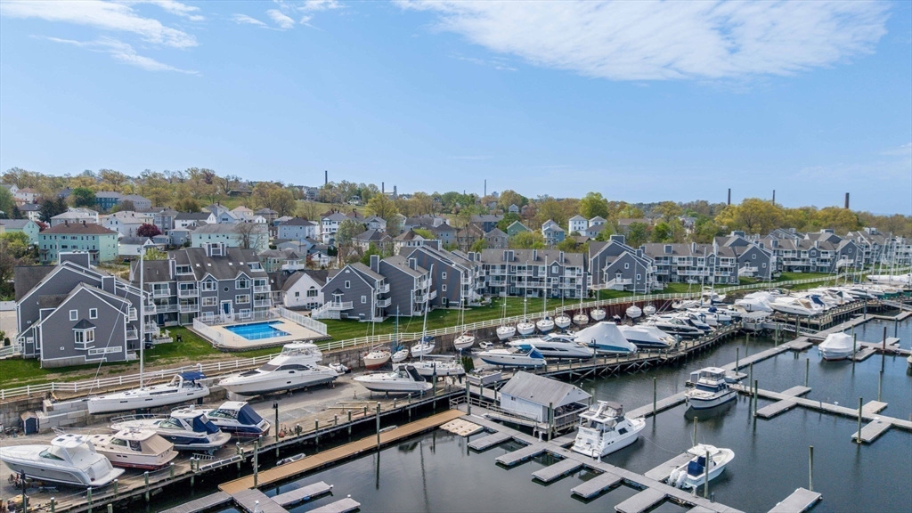 700 Shore Drive, Unit 509 Fall River, MA 02721 - Photo 3 of 25 a view of a lake with lawn chairs