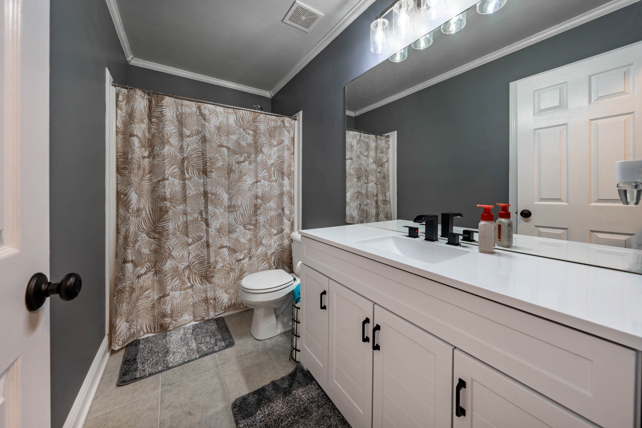 1101 Rustling Oaks Drive Pleasant View, TN 37146 - Photo 16 of 19 a bathroom with a granite countertop sink mirror vanity and toilet