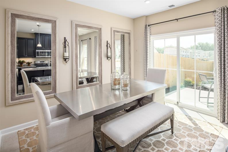 6607 Pathfinder Way Raleigh, NC 27616 - Photo 2 of 6 a room with furniture and large windows