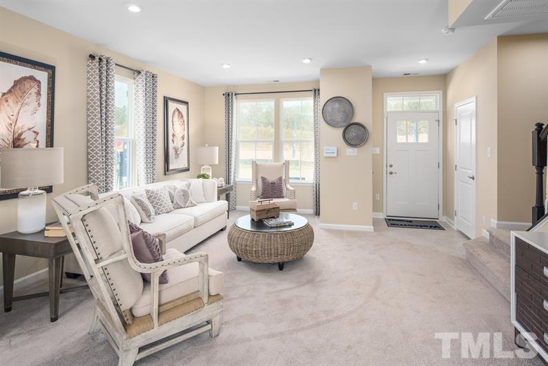 6607 Pathfinder Way Raleigh, NC 27616 - Photo 3 of 6 a living room with furniture and a large window