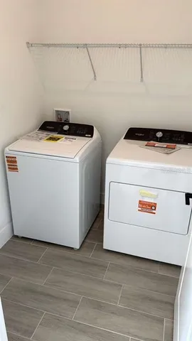 a utility room with washer and dryer