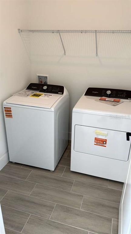 2827 Southwest 137th Lane Ocala, FL 34473 - Photo 11 of 11 a utility room with washer and dryer