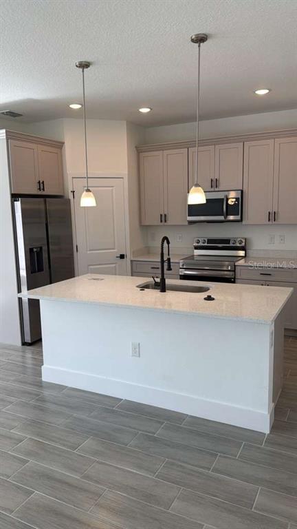 2827 Southwest 137th Lane Ocala, FL 34473 - Photo 4 of 11 a large kitchen with cabinets wooden floor and a window