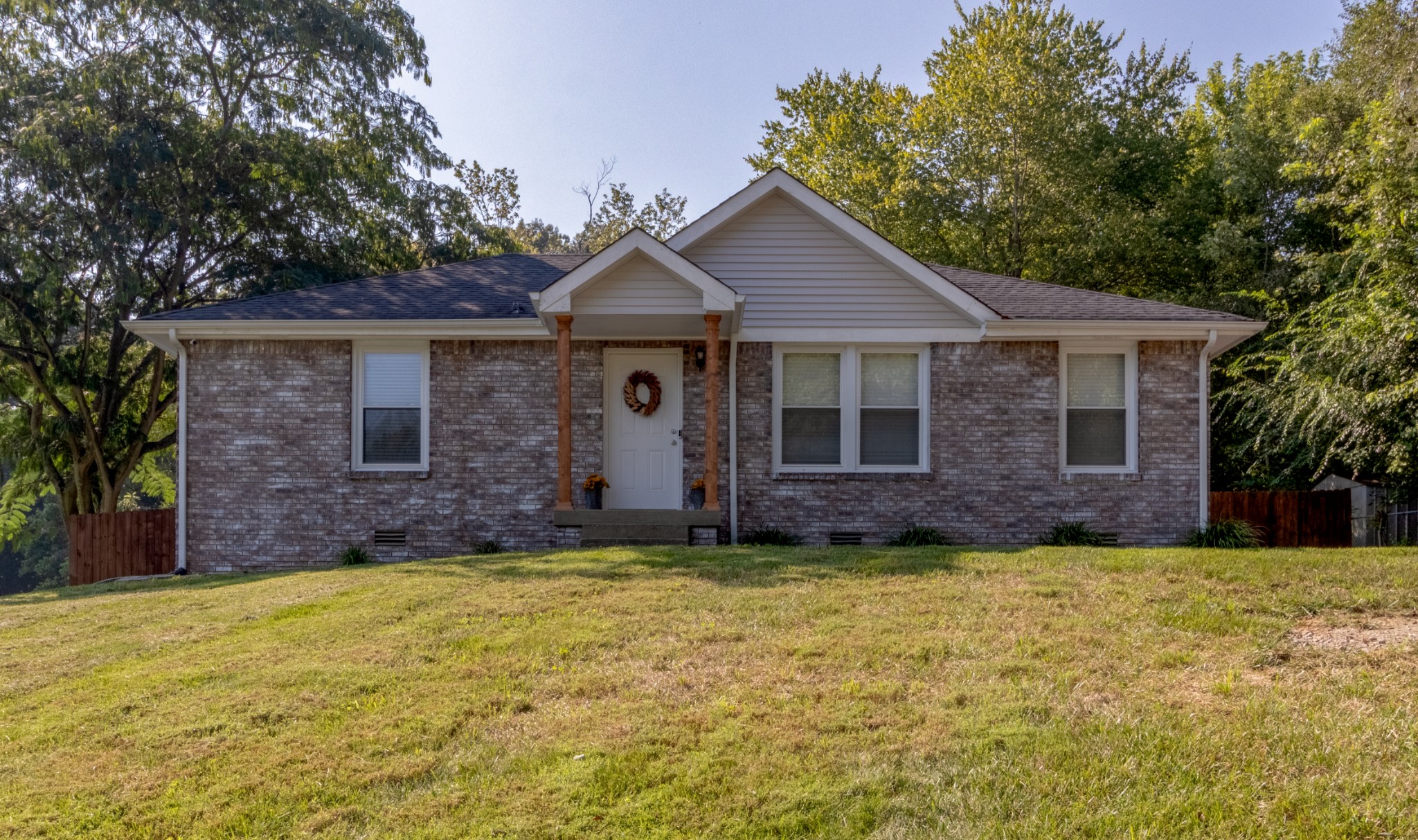 720 Dean Road Clarksville, TN 37040 - Photo 1 of 33 a view of a brick house with a yard