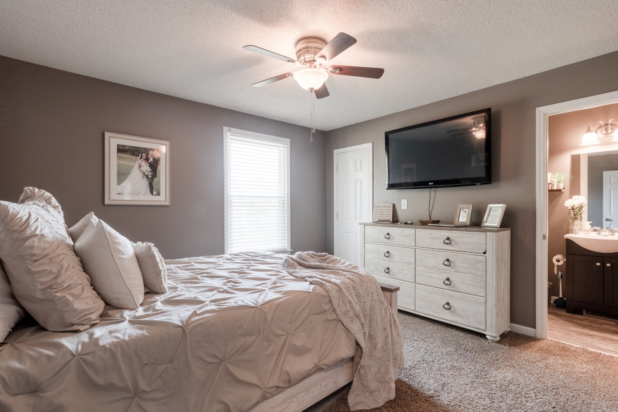 720 Dean Road Clarksville, TN 37040 - Photo 18 of 33 a bedroom with a large bed and a flat screen tv