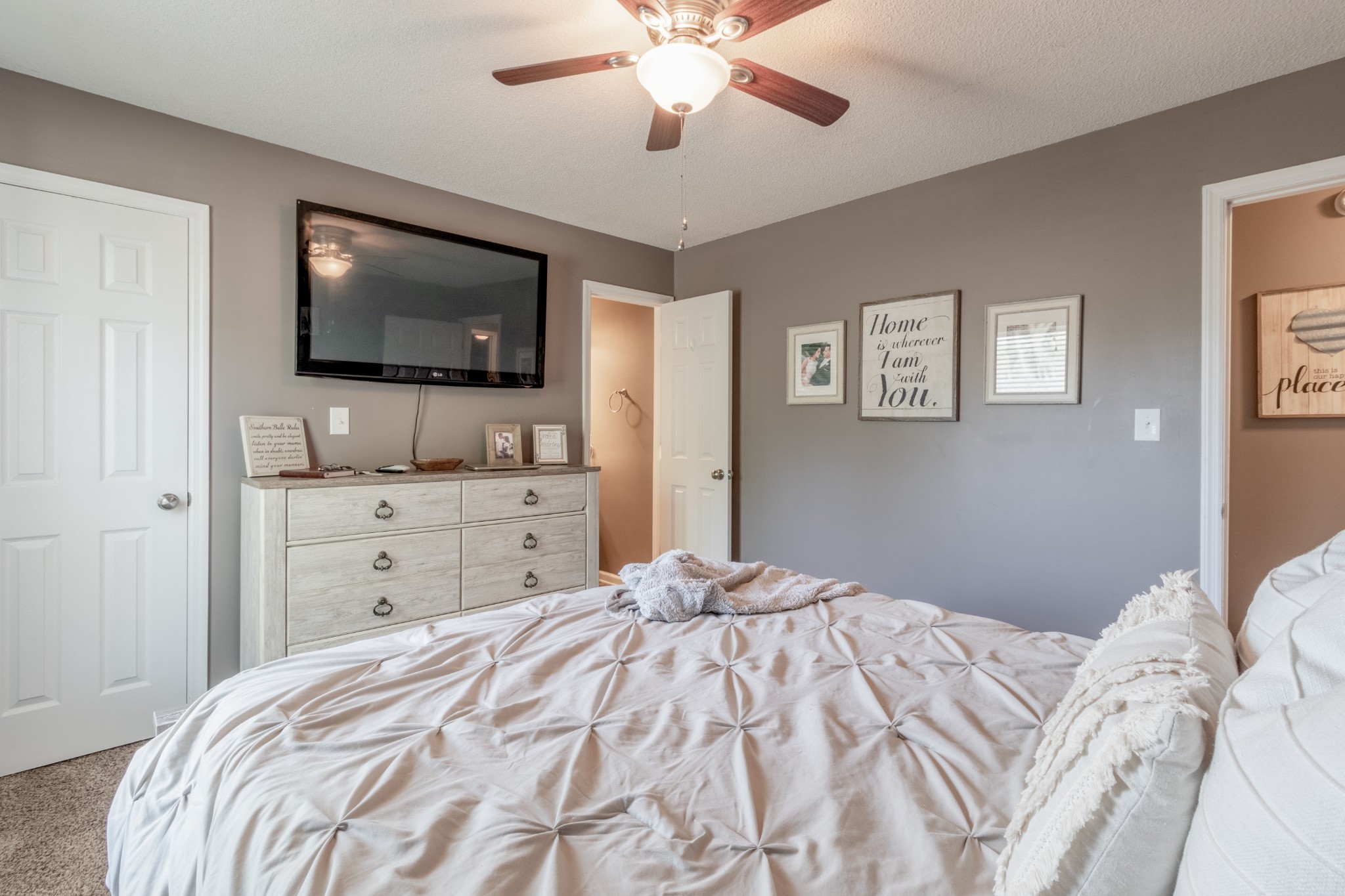 720 Dean Road Clarksville, TN 37040 - Photo 19 of 33 a bedroom with a large bed and a flat screen tv