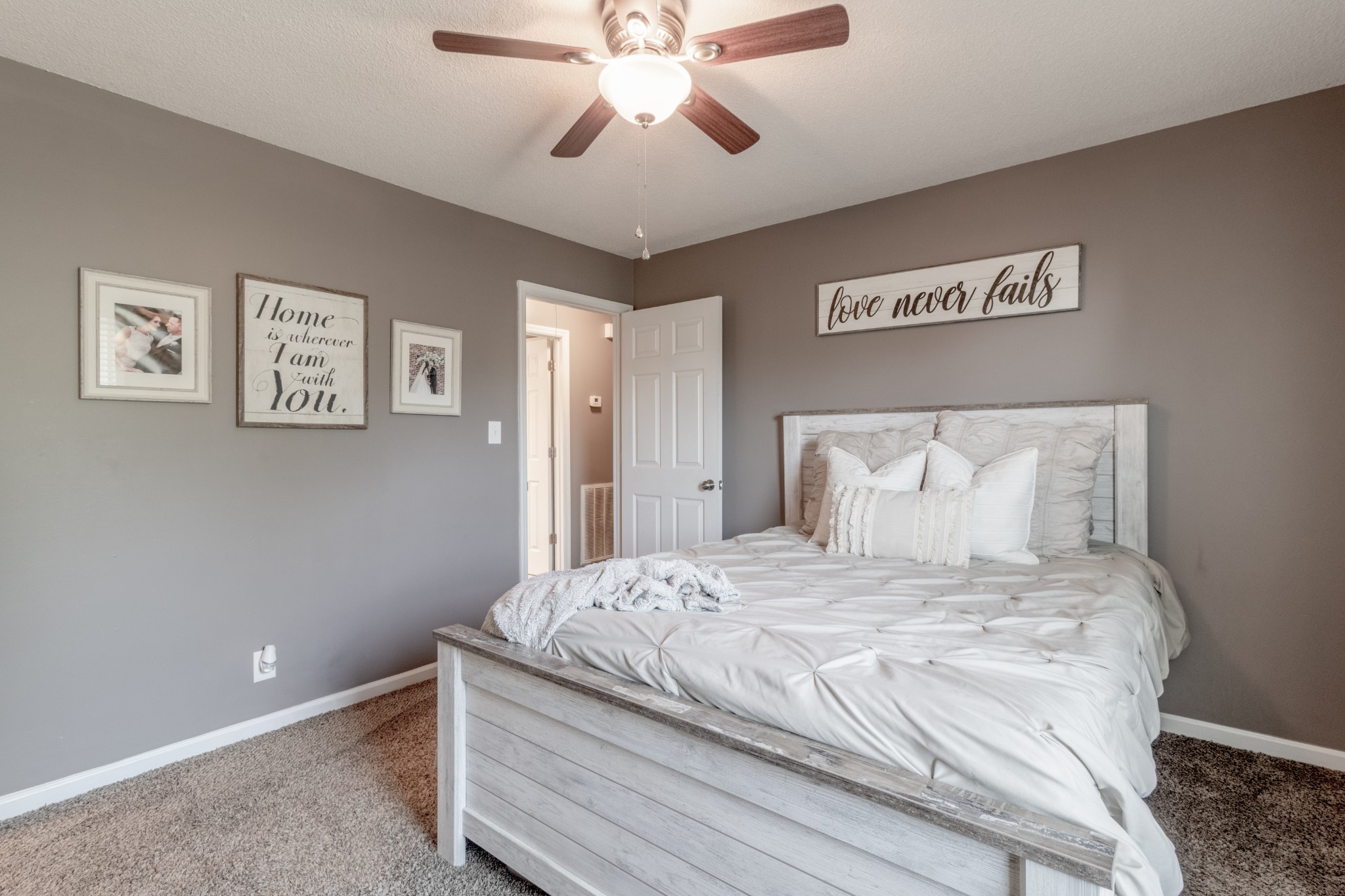 720 Dean Road Clarksville, TN 37040 - Photo 20 of 33 a bedroom with a large bed and a chandelier
