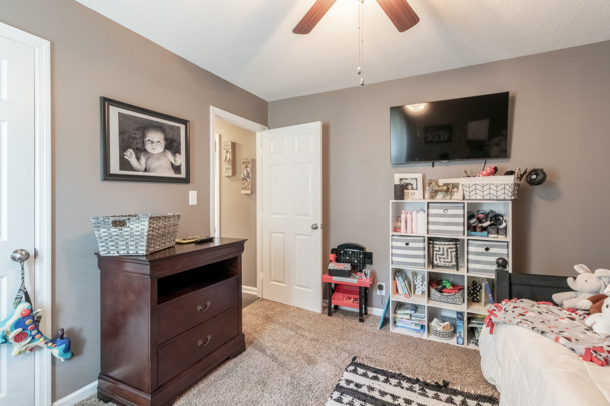 720 Dean Road Clarksville, TN 37040 - Photo 24 of 33 a bedroom with a bed and flat screen tv