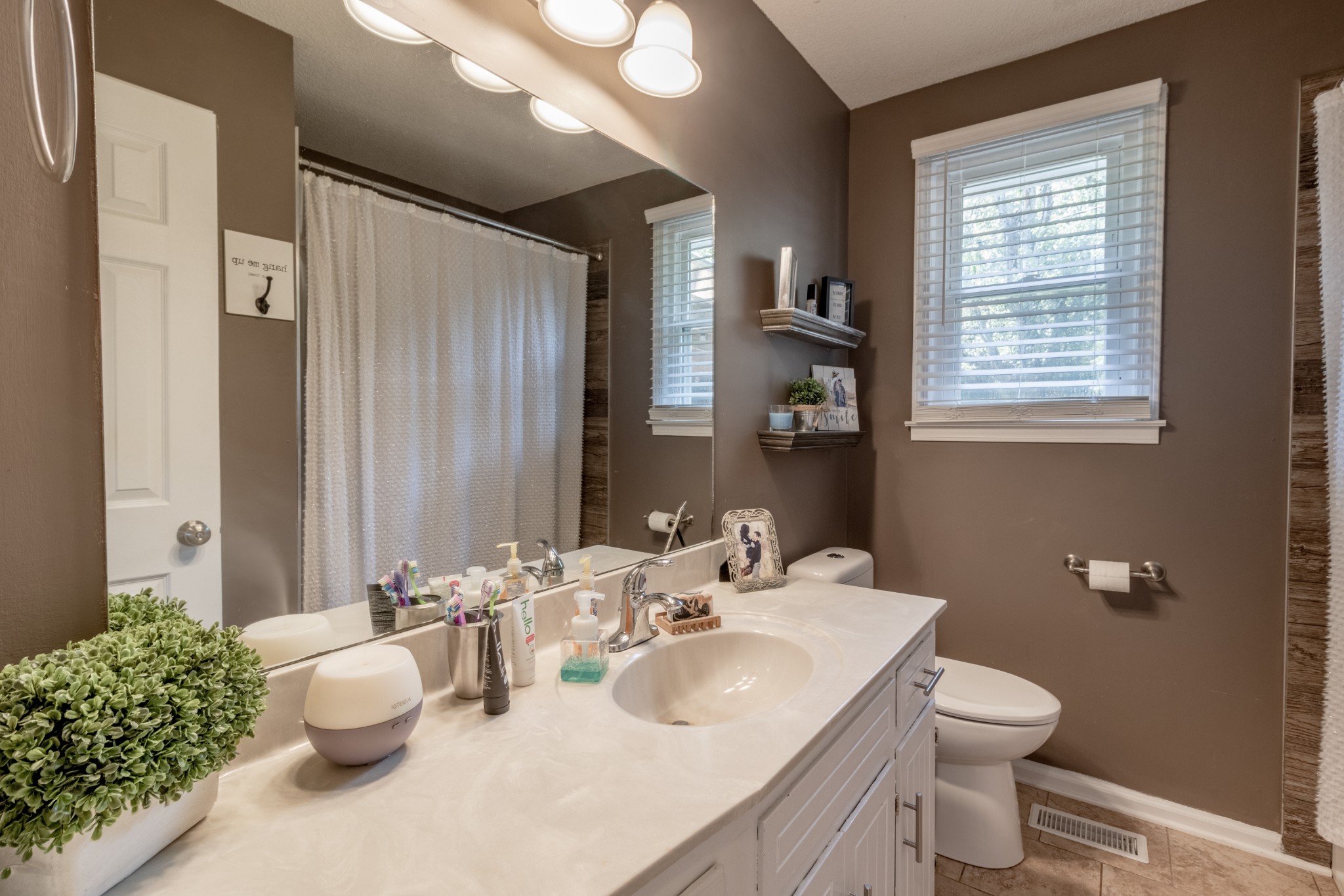 720 Dean Road Clarksville, TN 37040 - Photo 25 of 33 a bathroom with a toilet sink and mirror