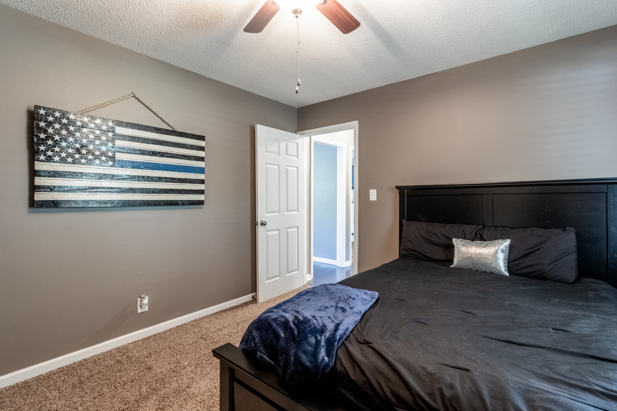 720 Dean Road Clarksville, TN 37040 - Photo 26 of 33 a bedroom with a bed and wooden floor