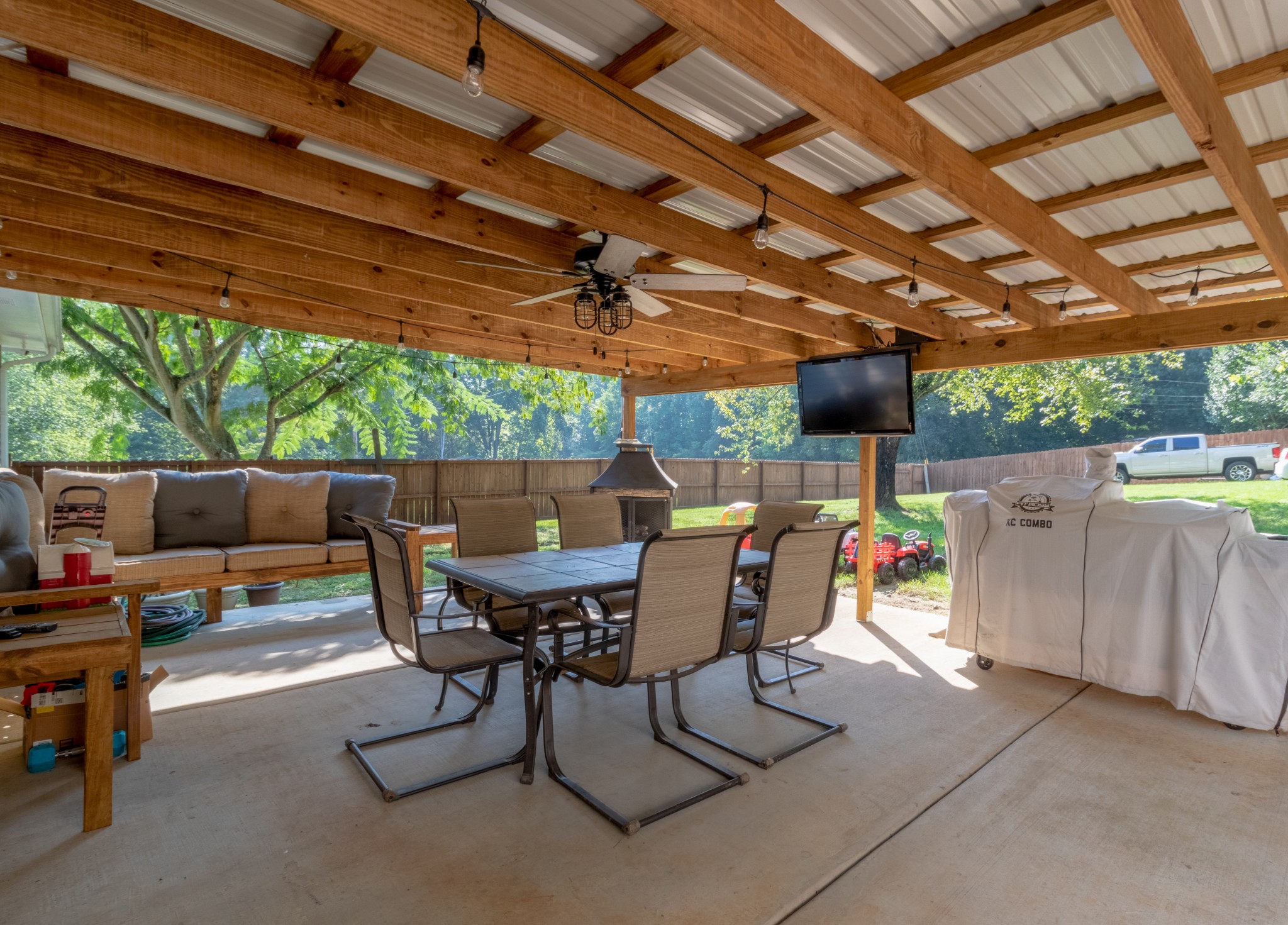 720 Dean Road Clarksville, TN 37040 - Photo 27 of 33 a view of patio with a table and chairs under an umbrella with a barbeque grill