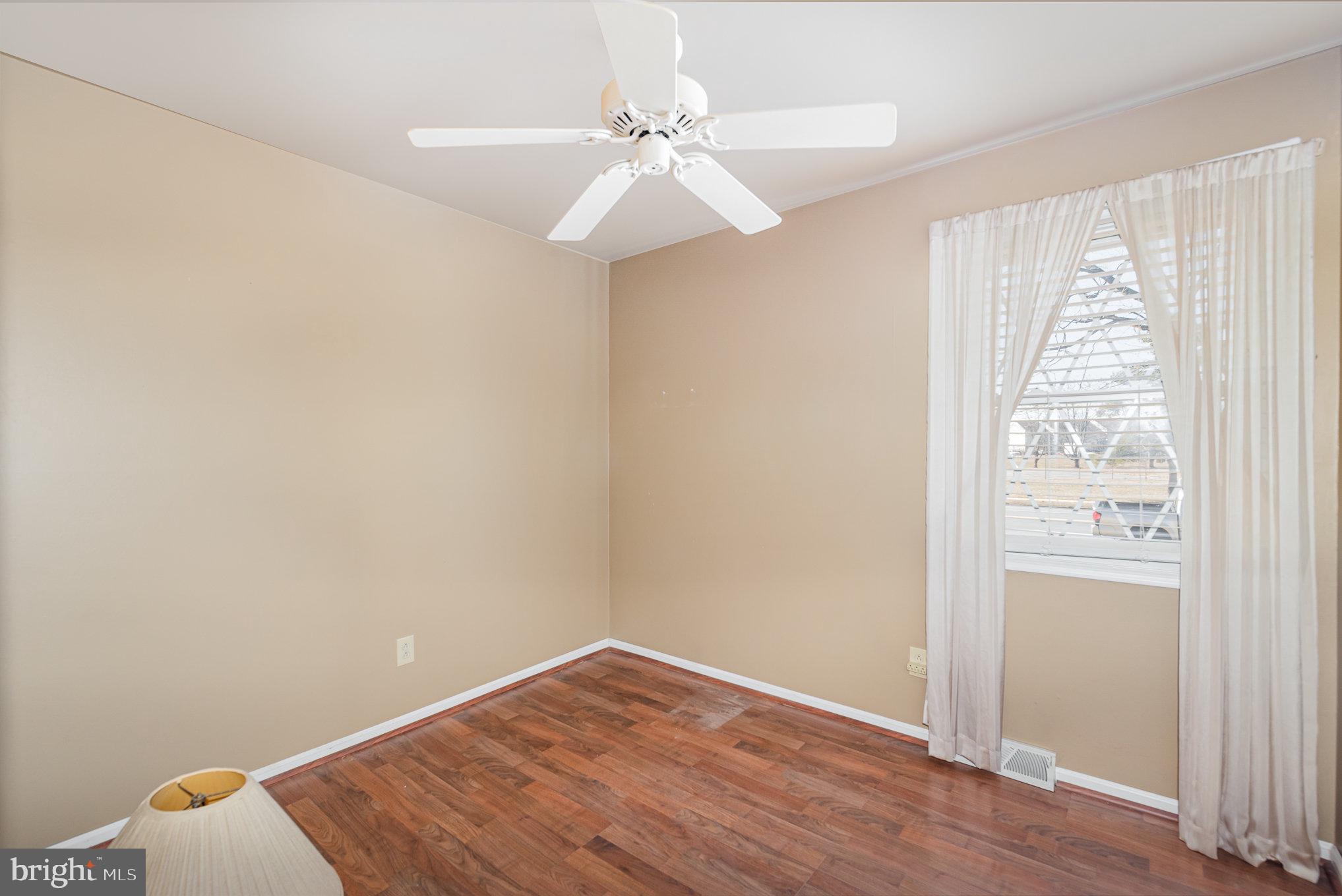 517 Joppa Farm Road Joppa, MD 21085 - Photo 17 of 25 an empty room with windows and fan