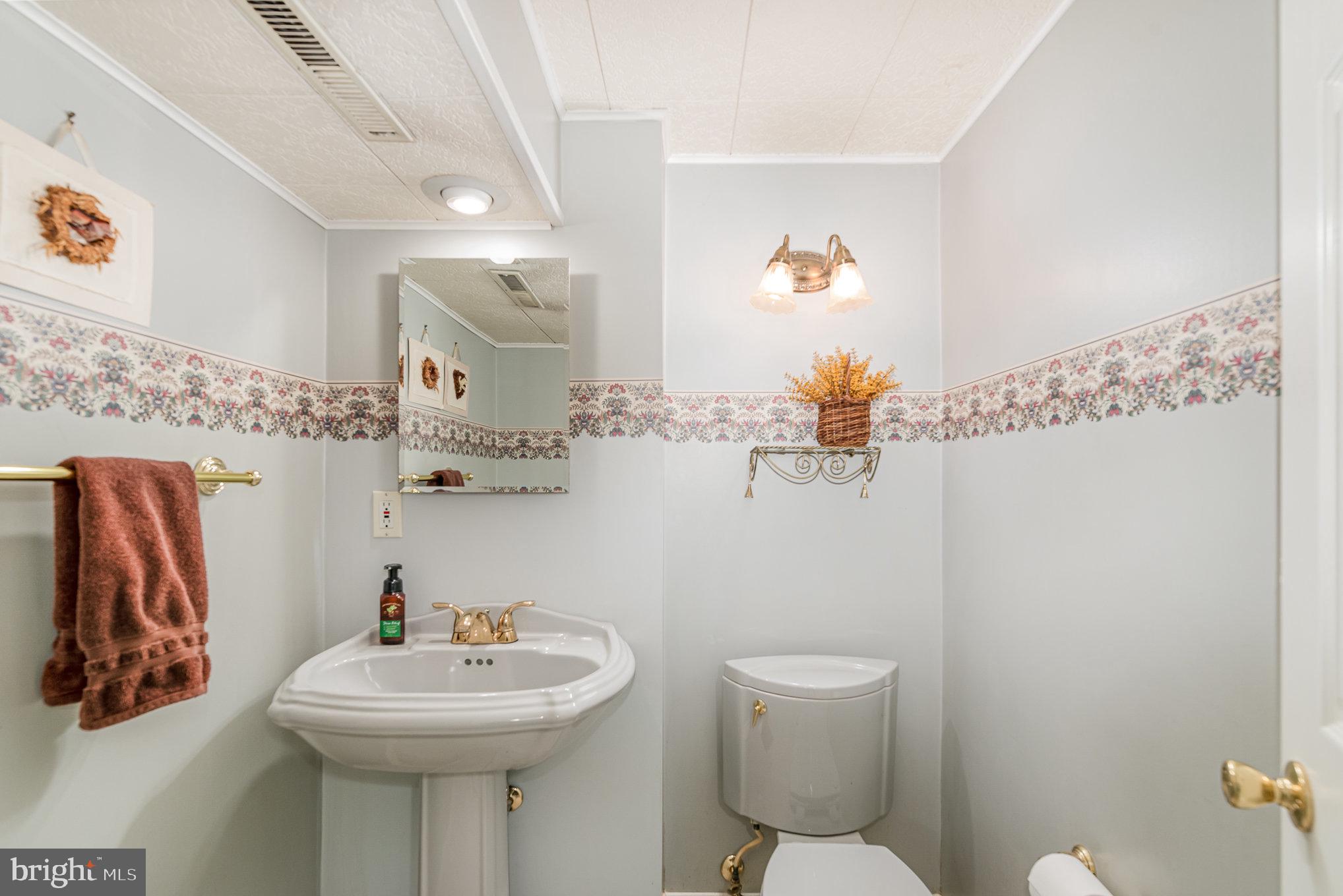 517 Joppa Farm Road Joppa, MD 21085 - Photo 20 of 25 a bathroom with a sink mirror and toilet