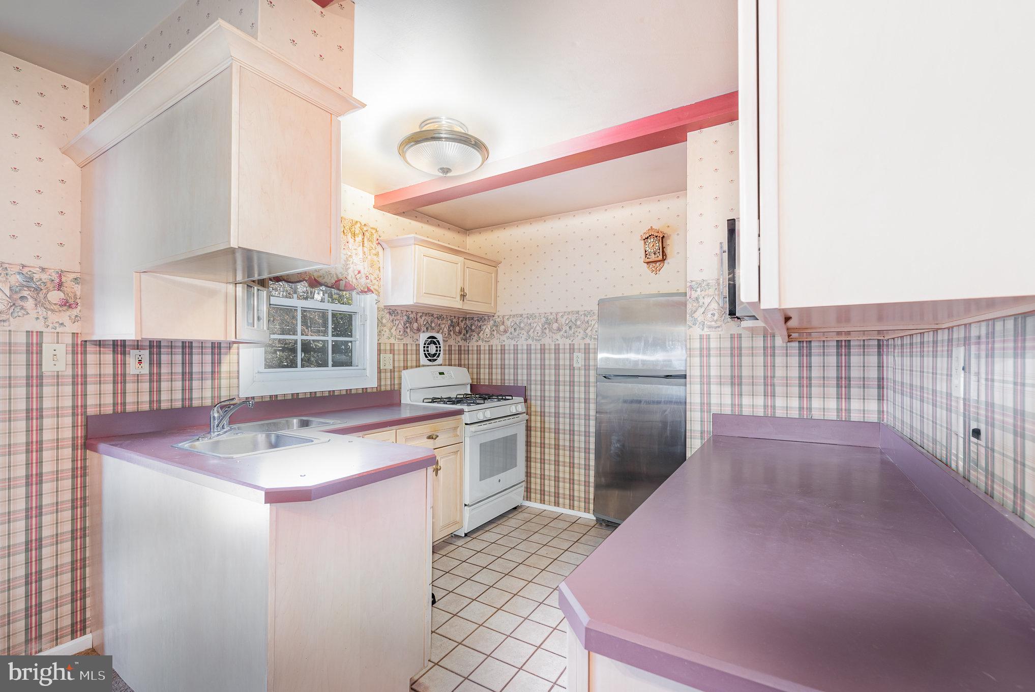 517 Joppa Farm Road Joppa, MD 21085 - Photo 9 of 25 a kitchen with cabinets and window
