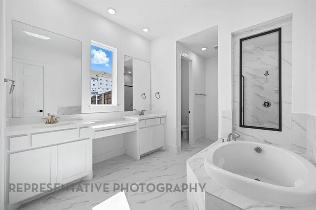 a bathroom with a bathtub and a shower