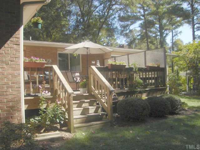 206 Dartmouth Road Raleigh, NC 27609 - Photo 2 of 9 a view of a small yard next to a yard