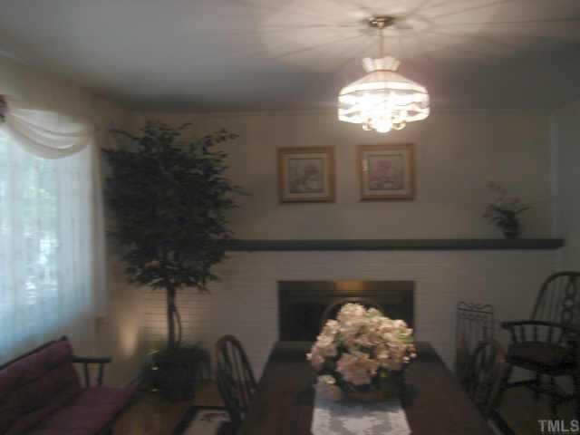 206 Dartmouth Road Raleigh, NC 27609 - Photo 6 of 9 a view of a chandelier in a livingroom