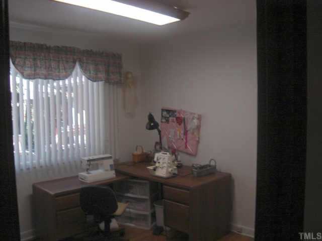 206 Dartmouth Road Raleigh, NC 27609 - Photo 8 of 9 a view of a workspace with furniture and a window