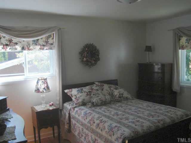 206 Dartmouth Road Raleigh, NC 27609 - Photo 9 of 9 a bedroom with a bed and window
