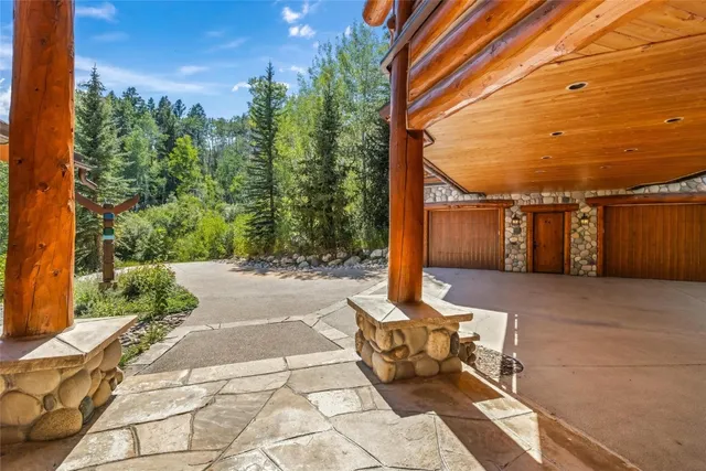 a balcony with view of the back yard