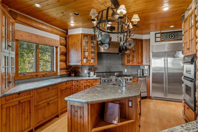 a kitchen that has a lot of cabinets in it