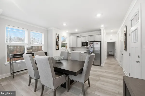 a kitchen with stainless steel appliances granite countertop a refrigerator sink and microwave