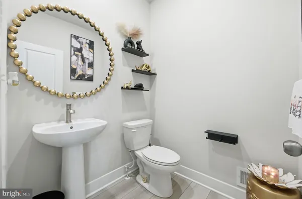 a view of a livingroom with furniture and a flat screen tv