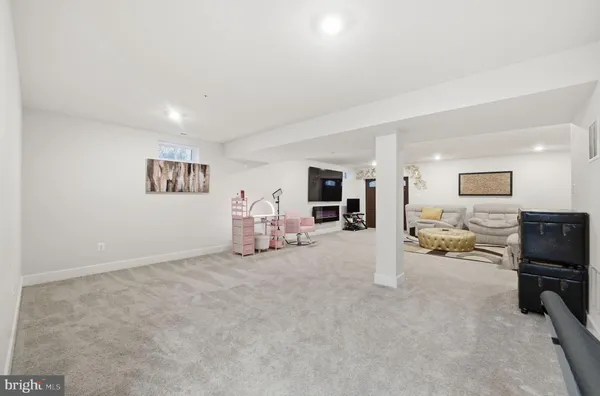 a view of a livingroom with furniture and a flat screen tv