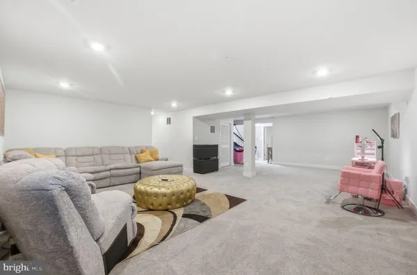 a room with furniture and flat screen tv